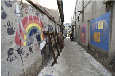 A Mullae alley with hand-painted murals